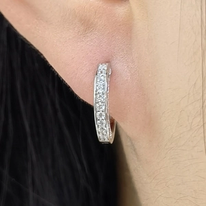 Macro shot of S925 sterling silver hoop earrings with pavé set cubic zirconia stones