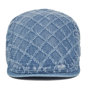Washed denim beret hat with diamond quilted pattern and frayed edges in denim blue