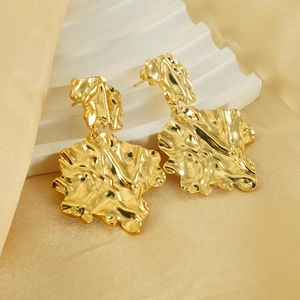 Irregular lava leaf earrings 18K gold plated stainless steel on satin background