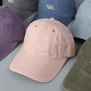 Variety of colorful washed cotton baseball caps featuring embroidered letter design