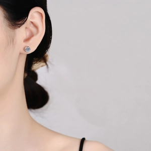 Classic 925 sterling silver moissanite stud earrings shown on model for daily wear