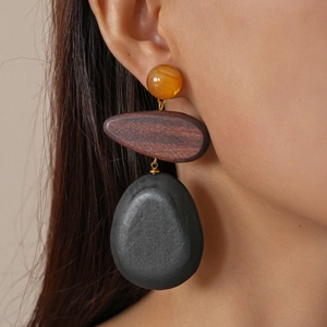 Retro resin and wood teardrop earrings featuring amber beads and black stone accents