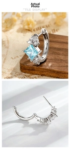 Detail of square sky blue zircon earrings with sparkling white crystals in silver