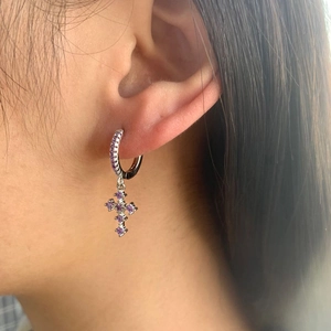 Luxurious S925 silver hoop earrings with purple zircon cross pendant on model