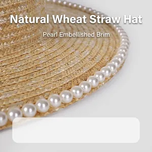 Natural wheat straw hat for women with pearl embellishments on a wide sunshade brim