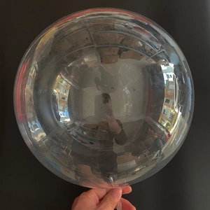 Clear 18-inch luminous BoBo balloon showing high transparency and spherical inflatable shape