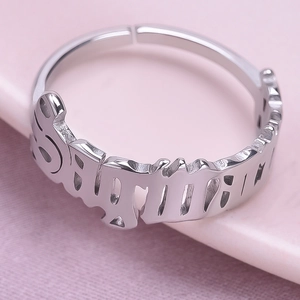 Macro shot of silver Sagittarius zodiac cutout adjustable ring in polished stainless steel