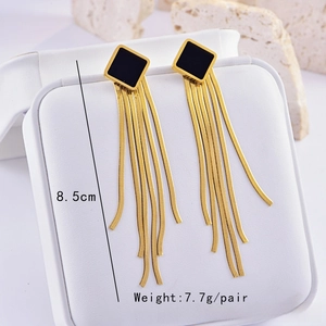 Detail of long gold snake chain tassel earrings with black square studs, 8.5cm length