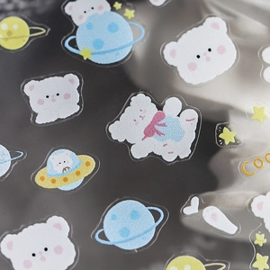 Space-themed bear nail art stickers with cute planets and stars on transparent backing