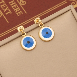 Golden double-layer evil eye jewelry set with blue enamel pendants on beige leather