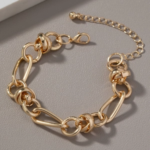 Detailed view of a gold chunky chain bracelet featuring a lobster clasp and extension chain