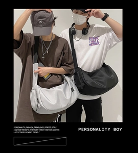 Waterproof nylon crossbody sports bag in black and silver gray with wide shoulder straps