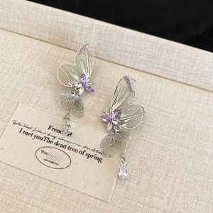 Elegant purple crystal butterfly earrings with silver hollow design and tassel drop charms