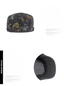 Close-up of vintage floral denim beret showing adjustable metal buckle and stitching