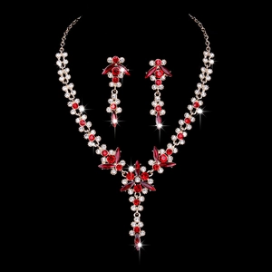 Elegant bridal necklace and earrings set with red crystals and floral gold metal design