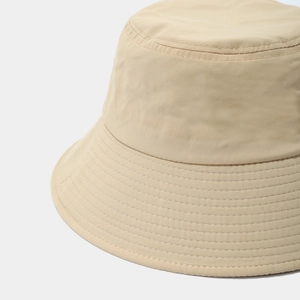 Detail shot showing the reinforced stitching on the wide brim of this beige sun bucket hat