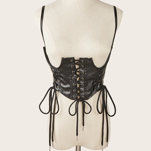 Close-up of black PU leather corset vest with punk-style lace-up cord and metal eyelets
