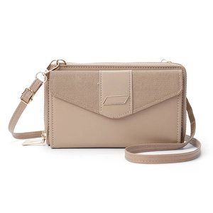 Close-up of khaki and beige crossbody bag showing premium leather and fabric texture