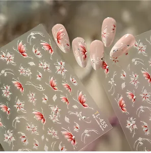 Detailed 3D embossed floral and butterfly nail art stickers with pearl accents