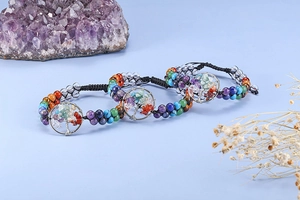 Detail of Tree of Life bracelets with woven cords and seven chakra natural stone chips