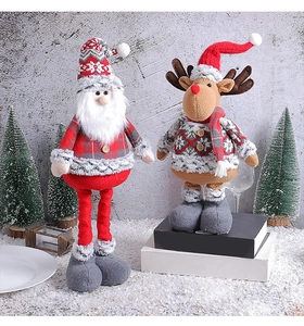 Detailed view of plush Christmas Santa and reindeer figurines with knitted festive textures