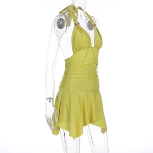 Detail of yellow halter neck dress with deep V-neck and golden metal ring accents