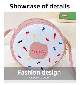 Close-up of pink round donut crossbody bag for girls with Hello lettering and zipper