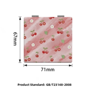 Detail view of the pink cherry pattern compact mirror showing 71mm by 67mm dimensions