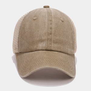 Detail of khaki mesh trucker hat with washed cotton fabric and vintage stitching