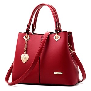Chic red leather tote bag with heart metal charm for women, large capacity shoulder handbag