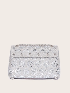 Close-up of silver sunflower evening bag with crystal rhinestones and metal chain strap