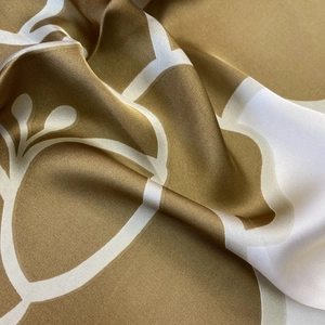 Golden brown and white floral satin silk scarf with elegant glossy finish and smooth drape