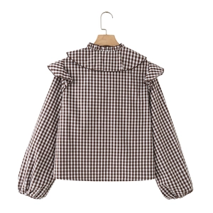 Brown and white plaid long sleeve blouse with ruffle collar and puff sleeves on hanger
