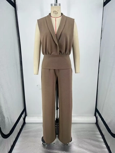 Detail of brown V-neck sleeveless top and wide-leg trousers set with textured fabric