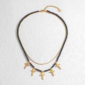Double-layered stainless steel necklace with black faceted beads and gold cross charms