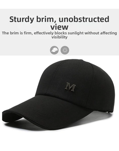 Detail of black cotton baseball cap with silver metal M logo on side profile