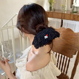 Black polka dot ruffle scrunchie with red heart button and handmade label for women