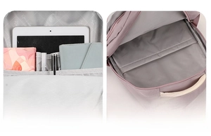 Detail view of purple school backpack showing 15-inch laptop sleeve and internal pockets