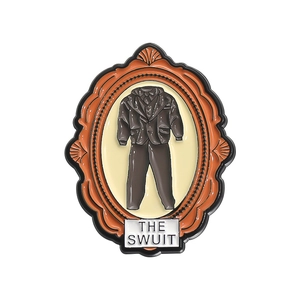 Enamel brooch with retro frame and gray suit design featuring THE SWUIT text