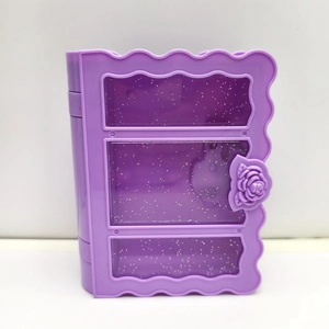 Detail of purple book-shaped storage box with glitter windows and rose clasp detail
