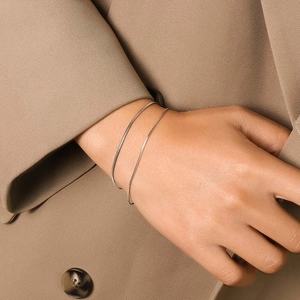 Polished silver thin double layer snake bone chain bracelet for women on wrist