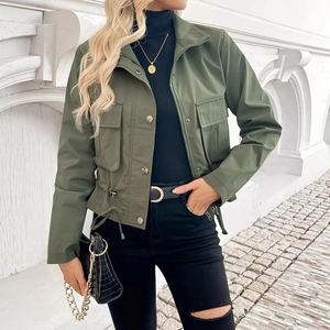 Detail of olive green utility jacket featuring large flap pockets and adjustable drawstring