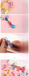 Macro detail of acrylic keychains featuring colorful beads and engraved charms