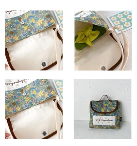 Detail view of floral canvas bag with magnetic buckle closure and durable brown trim