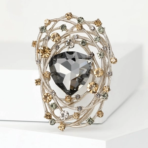 Vintage bird nest brooch with dark grey crystal and champagne rhinestones on silver metal