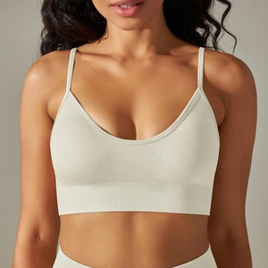 Close-up of seamless knit texture and ribbed hem on a cream yoga sports bra