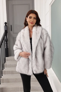Detail of grey-white faux fur coat showing thick plush texture and elegant lapel design