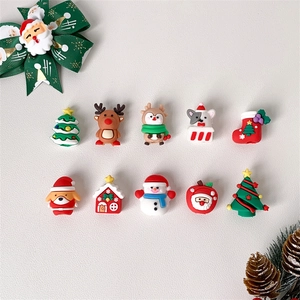 Detail of cute Christmas 3D cartoon charms featuring reindeer, snowman and Xmas tree motifs