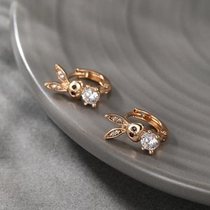 Detail of rose gold rabbit earrings with sparkling micro-pave crystals and zircon