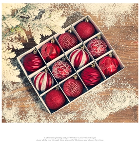 Detailed set of 12 red Christmas balls in various textures like glitter and matte patterns